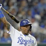 
              Kansas City Royals' Salvador Perez warms up before batting during the third inning of a baseball game against the Cleveland Indians Thursday, Sept. 30, 2021, in Kansas City, Mo. Kansas City, Mo. (AP Photo/Charlie Riedel)
            