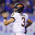 
              Oklahoma State quarterback Spencer Sanders looks for a recever during the first half of the team's NCAA college football game against Boise State on Saturday, Sept. 18, 2021, in Boise, Idaho. (AP Photo/Steve Conner)
            