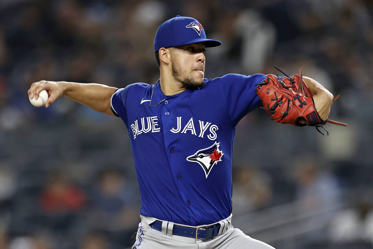 Toronto Blue Jays pitcher Jose Berrios throws to a New York Yankees batter during the third inning ...