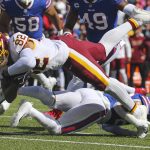 
              Washington Football Team's Logan Thomas (82) is tackled by Buffalo Bills' Micah Hyde (23) during the first half of an NFL football game Sunday, Sept. 26, 2021, in Orchard Park, N.Y. (AP Photo/Jeffrey T. Barnes)
            