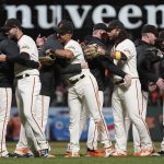 
              San Francisco Giants players celebrate after defeating the San Diego Padres in a baseball game to clinch a postseason berth in San Francisco, Monday, Sept. 13, 2021. (AP Photo/Jeff Chiu)
            