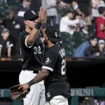 
              Chicago White Sox's Gavin Sheets (32) and Leury Garcia celebrate the team's 9-3 win over the Los Angeles Angels in a baseball game Tuesday, Sept. 14, 2021, in Chicago. (AP Photo/Charles Rex Arbogast)
            