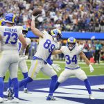 
              Los Angeles Rams tight end Tyler Higbee (89) celebrates after his touchdown catch during the first half of an NFL football game against the Tampa Bay Buccaneers Sunday, Sept. 26, 2021, in Inglewood, Calif. (AP Photo/Jae C. Hong )
            