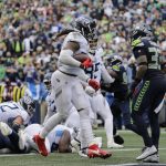 
              Tennessee Titans running back Derrick Henry, 22, scores a touchdown against the Seattle Seahawks during the second half of an NFL football game, Sunday, Sept. 19, 2021, in Seattle. The extra point was good and the score tied the game at 30-30. (AP Photo/John Froschauer)
            