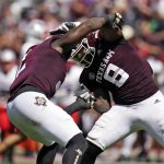 
              Texas A&M defensive linemen Micheal Clemons (2) and DeMarvin Leal (8) react after sacking New Mexico quarterback Terry Wilson (2) for an 8-yard loss during the first half of an NCAA college football game on Saturday, Sept. 18, 2021, in College Station, Texas. (AP Photo/Sam Craft)
            