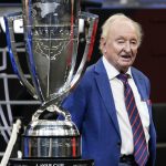 
              Tennis great Rod Laver stands next to the Laver Cup during opening ceremonies for Laver Cup tennis, Friday, Sept. 24, 2021, in Boston. (AP Photo/Elise Amendola)
            