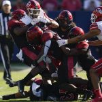 
              Utah running back Micah Bernard (2) is tackled by San Diego State defenders during the first half of an NCAA college football game Saturday, Sept. 18, 2021, in Carson, Calif. (AP Photo/Ashley Landis)
            