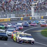 
              Drivers restart after a caution during a NASCAR Cup Series auto race at Las Vegas Motor Speedway. Sunday, Sept. 26, 2021, in Las Vegas. (AP Photo/Steve Marcus)
            