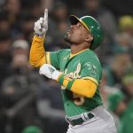 
              Oakland Athletics' Tony Kemp reacts as he crosses the plate after hitting a solo home run during the sixth inning of a baseball game against the Seattle Mariners, Wednesday, Sept. 29, 2021, in Seattle. (AP Photo/Ted S. Warren)
            