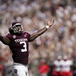 
              Texas A&M defensive lineman Tyree Johnson (3) reacts after sacking New Mexico quarterback Terry Wilson (2) during the first half of an NCAA college football game on Saturday, Sept. 18, 2021, in College Station, Texas. (AP Photo/Sam Craft)
            
