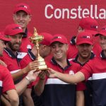 
              Team USA holds the trophy after the Ryder Cup matches at the Whistling Straits Golf Course Sunday, Sept. 26, 2021, in Sheboygan, Wis. (AP Photo/Charlie Neibergall)
            