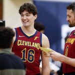 
              Cleveland Cavaliers' Kevin Love (0) interviews Cedi Osman (16) during the NBA basketball team's media day, Monday, Sept. 27, 2021, in Independence, Ohio. (AP Photo/Ron Schwane)
            