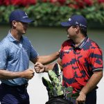 
              Billy Horschel, left, and Patrick Reed, right, greet each other on the first tee during the first round of the Tour Championship golf tournament Thursday, Sept. 2, 2021, at East Lake Golf Club in Atlanta. (AP Photo/Brynn Anderson)
            