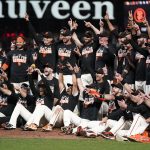 
              San Francisco Giants players celebrate after defeating the San Diego Padres in a baseball game to clinch a postseason berth in San Francisco, Monday, Sept. 13, 2021. (AP Photo/Jeff Chiu)
            