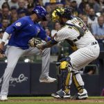 
              Milwaukee Brewers catcher Omar Narvaez tags out Chicago Cubs' Sergio Alcantara at home during the fourth inning of a baseball game Friday, Sept. 17, 2021, in Milwaukee. Alcantara tried to score from third on a ball hit by Zach Davies. (AP Photo/Morry Gash)
            