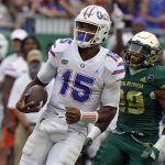 
              Florida quarterback Anthony Richardson (15) gets past South Florida linebacker Brian Norris (29) on an 80-yard touchdown run during the second half of an NCAA college football game Saturday, Sept. 11, 2021, in Tampa, Fla. (AP Photo/Chris O'Meara)
            