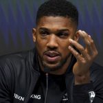 
              Britain's Anthony Joshua speaks during a press conference after his loss to Oleksandr Usyk of Ukraine in the WBA (Super), WBO and IBF boxing title bout at the Tottenham Hotspur Stadium in London Saturday Sept. 25, 2021. (Nick Potts/PA via AP)
            