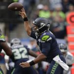 
              Seattle Seahawks quarterback Russell Wilson passes against the Tennessee Titans during the second half of an NFL football game, Sunday, Sept. 19, 2021, in Seattle. (AP Photo/John Froschauer)
            
