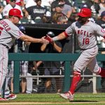 
              Los Angeles Angels' Jose Rojas, right, celebrates with third base coach Brian Butterfield after hitting a two-run home run during the fourth inning of a baseball game against the Chicago White Sox in Chicago, Thursday, Sept. 16, 2021. (AP Photo/Nam Y. Huh)
            