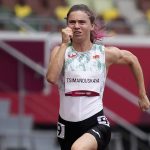 
              FILE - In this Friday, July 30, 2021 file photo, Krystsina Tsimanouskaya, of Belarus, runs in the women's 100-meter run at the 2020 Summer Olympics, Japan. An investigation into two Belarus team officials who tried to force sprinter Krystsina Tsimanouskaya on a flight from the Tokyo Olympics will now be run by track and field authorities. World Athletics said on Thursday Sept. 30, 2021, its independent Athletics Integrity Unit is taking over the case from the International Olympic Committee. (AP Photo/Martin Meissner, File)
            
