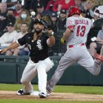 
              Los Angeles Angels' Phil Gosselin beats the throw to Jose Abreu for an RBI infield single during the third inning of a baseball game Wednesday, Sept. 15, 2021, in Chicago. Gosselin was originally called out, but the call was overturned after video review. (AP Photo/Charles Rex Arbogast)
            