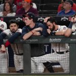 
              The Atlanta Braves watch from the dugout in the ninth inning of their 5-4 loss to Colorado Rockies in a baseball game Tuesday, Sept. 14, 2021, in Atlanta. (AP Photo/John Bazemore)
            