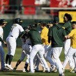 
              Oakland Athletics players celebrate defeating the Houston Astros after a baseball game in Oakland, Calif., Sunday, Sept. 26, 2021. The Athletics won 4-3. (AP Photo/John Hefti)
            