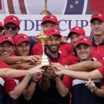 
              Team USA players and captains pose with the trophy after the Ryder Cup matches at the Whistling Straits Golf Course Sunday, Sept. 26, 2021, in Sheboygan, Wis. (AP Photo/Ashley Landis)
            