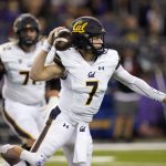 
              California quarterback Chase Garbers (7) gets a pass off under pressure in the first half of an NCAA college football game against Washington, Saturday, Sept. 25, 2021, in Seattle. (AP Photo/Elaine Thompson)
            