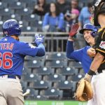 
              Chicago Cubs Rafael Ortega (66) is greeted by teammate Frank Schwindell second from right, after he hit a solo home run during the first inning of a baseball game, Thursday, Sept. 30, 2021 in Pittsburgh.  Pittsburgh Pirates catcher Jacob Stallings, right, looks on. (AP Photo/Philip G. Pavely)
            
