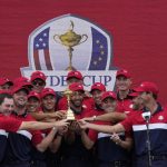 
              Team USA players pose with the trophy after the Ryder Cup matches at the Whistling Straits Golf Course Sunday, Sept. 26, 2021, in Sheboygan, Wis. (AP Photo/Ashley Landis)
            