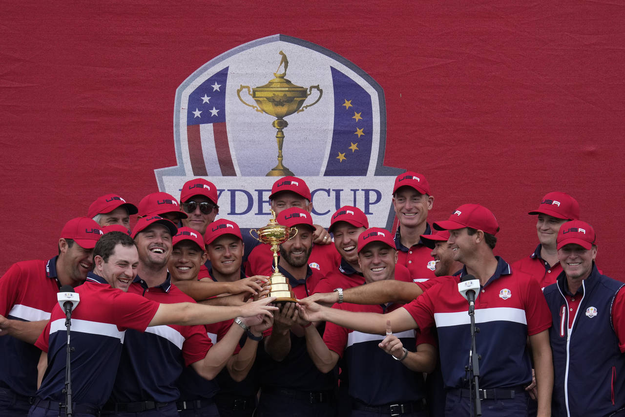 Team USA players pose with the trophy after the Ryder Cup matches at the Whistling Straits Golf Cou...