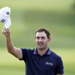 
              Patrick Cantlay tips his cap to the crowd after winning the Tour Championship golf tournament and the FedEx Cup at East Lake Golf Club, Sunday, Sept. 5, 2021, in Atlanta. (AP Photo/Brynn Anderson)
            