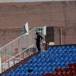 
              A Pakistani police officer stands guard an enclosure in the Pindi Cricket Stadium before the start of the first one day international cricket match between Pakistan and New Zealand, in Rawalpindi, Pakistan, Friday, Sept. 17, 2021. The limited-overs series between Pakistan and New Zealand has been postponed due to security concerns of the Kiwis. (AP Photo/Anjum Naveed)
            
