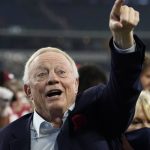
              Dallas Cowboys team owner Jerry Jones celebrates with Arkansas fans and the team after their win in an NCAA college football game against Texas A&M in Arlington, Texas, Saturday, Sept. 25, 2021. (AP Photo/Tony Gutierrez)
            