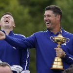 
              Team Europe captain Padraig Harrington and Team Europe's Matt Fitzpatrick smile as they pose for a team picture during a practice day at the Ryder Cup at the Whistling Straits Golf Course Tuesday, Sept. 21, 2021, in Sheboygan, Wis. (AP Photo/Charlie Neibergall)
            