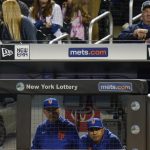 
              New York Mets manager Luis Rojas, below right, watches his team play during the first inning of a baseball game against the Miami Marlins, Thursday, Sept. 30, 2021, in New York. (AP Photo/Frank Franklin II)
            