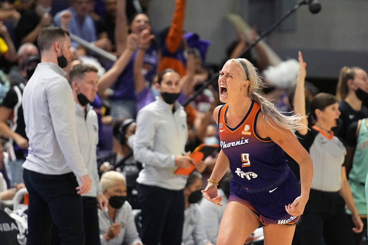 Phoenix Mercury guard Sophie Cunningham (9) reacts after scoring during the second half in the firs...