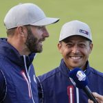 
              Team USA's Xander Schauffele and Team USA's Dustin Johnson smile after winning their four-ball match the Ryder Cup at the Whistling Straits Golf Course Friday, Sept. 24, 2021, in Sheboygan, Wis. (AP Photo/Ashley Landis)
            