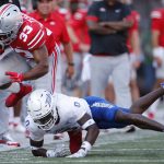 
              Tulsa defensive back Tyon Davis, bottom, tackles Ohio State running back Master Teague (33) during the first half of an NCAA college football game Saturday, Sept. 18, 2021, in Columbus, Ohio. (AP Photo/Jay LaPrete)
            
