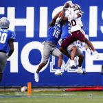 
              Mississippi State wide receiver Makai Polk (10) jumps up to make a catch over Memphis players during an NCAA college football game Saturday, Sept. 18, 2021, in Memphis, Tenn. (Patrick Lantrip/Daily Memphian via AP)
            