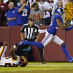 
              New York Giants wide receiver Darius Slayton (86) makes a touchdown catch against Washington Football Team cornerback William Jackson (23) during the second half of an NFL football game, Thursday, Sept. 16, 2021, in Landover, Md. (AP Photo/Patrick Semansky)
            