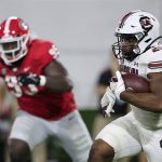 
              South Carolina running back Kevin Harris (20) carries the ball against Georgia during the first half of an NCAA college football game Saturday, Sept. 18, 2021, in Athens, Ga. (AP Photo/Butch Dill)
            