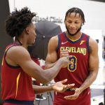 
              Cleveland Cavaliers' Collin Sexton, left, and Lamar Stevens play a game of rock paper scissors during the NBA basketball team's media day, Monday, Sept. 27, 2021, in Independence, Ohio. (AP Photo/Ron Schwane)
            