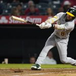 
              Oakland Athletics' Jed Lowrie grounds out during the seventh inning of a baseball game against the Los Angeles Angels Friday, Sept. 17, 2021, in Anaheim, Calif. (AP Photo/Ashley Landis)
            