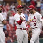 
              St. Louis Cardinals' Matt Carpenter, left, Nolan Arenado and Dylan Carlson (3) celebrate following a 4-3 victory over the Milwaukee Brewers in a baseball game Thursday, Sept. 30, 2021, in St. Louis. (AP Photo/Jeff Roberson)
            