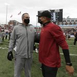 
              Washington State head coach Nick Rolovich, left, and Southern California interim head coach Donte Williams speak on the field after an NCAA college football game, Saturday, Sept. 18, 2021, in Pullman, Wash. Southern California won 45-14. (AP Photo/Young Kwak)
            