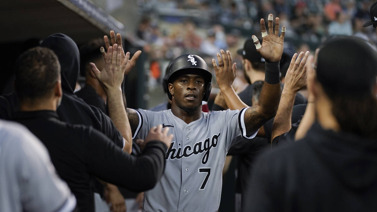 Chicago White Sox's Tim Anderson (7) celebrates scoring against the Detroit Tigers in the third inn...