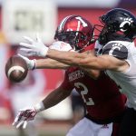 
              Cincinnati's Alec Pierce (12) tries to make a catch against Indiana's Reese Taylor (2) during the first half of an NCAA college football game, Saturday, Sept. 18, 2021, in Bloomington, Ind. (AP Photo/Darron Cummings)
            