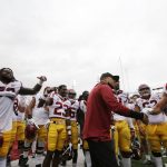 
              Southern California interim head coach Donte Williams, center, celebrates with his team after their 45-14 win over Washington State in an NCAA college football game, Saturday, Sept. 18, 2021, in Pullman, Wash. (AP Photo/Young Kwak)
            